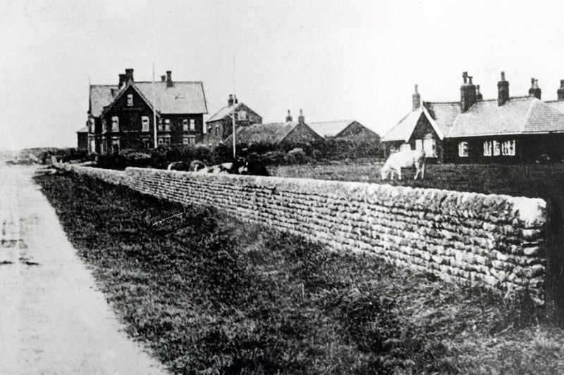 Looking along Victoria Road West towards the sea. The building on the left is Cleveleys Hotel. The bungalow on the right of the cobbled wall is the former home of a Major Nutter. The low thatched building in the centre was the first Cleveleys Post Office, early 1900s