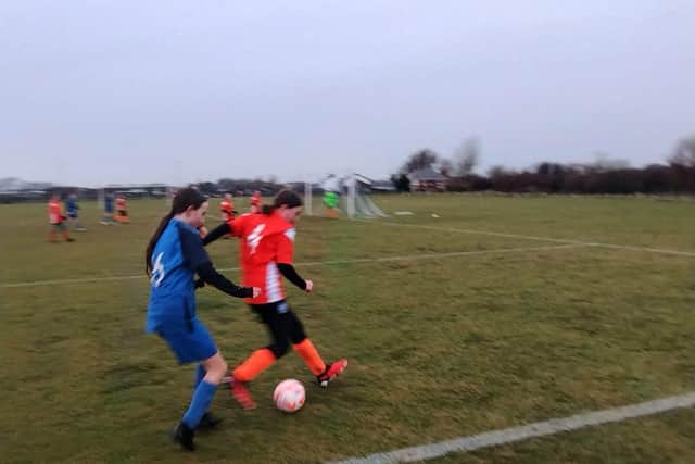 Left back Inda Dawson keeping the Euxton winger at bay. Photo: Johnathon Bailey