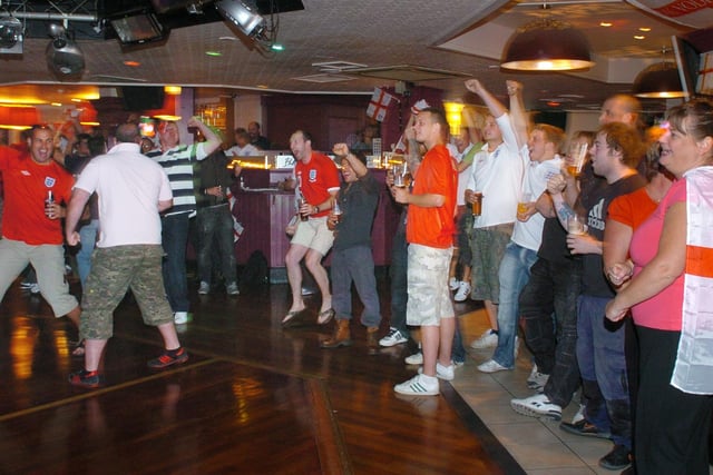 Locals and holidaymakers dug out their flags, hooters and scarves and gathered in Blackpool's Brannigans to watch the World Cup decider match between England and Slovenia in 2010