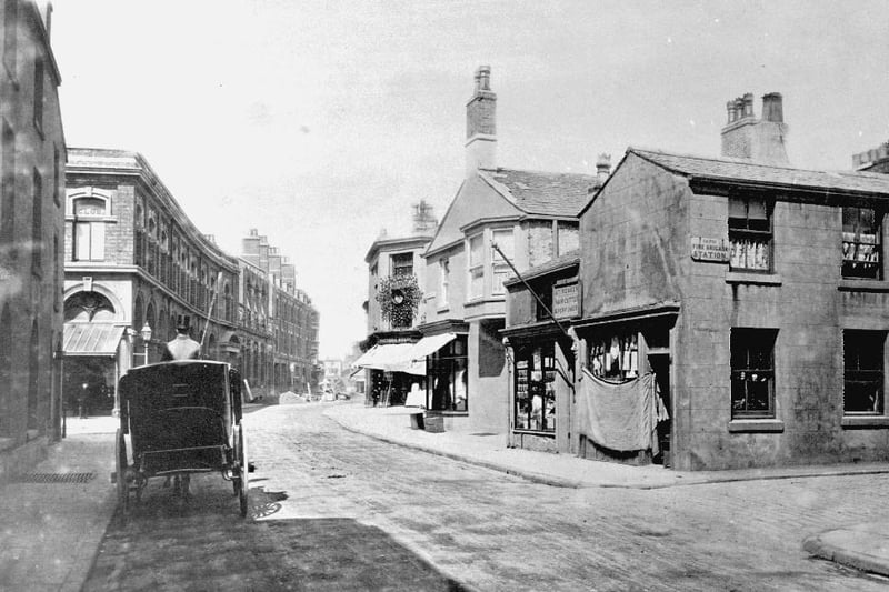 Another of Bank Hey Street in 1875. The shop on the right has a primitive sacking blind. Lewis's department store was later built on the left