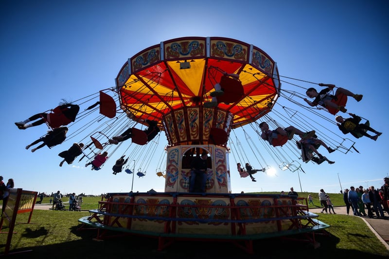 In glorious sunshine,  people enjoy the fun of the fair at Anchorsholme Park. Here,  one of the rides is is in full swing