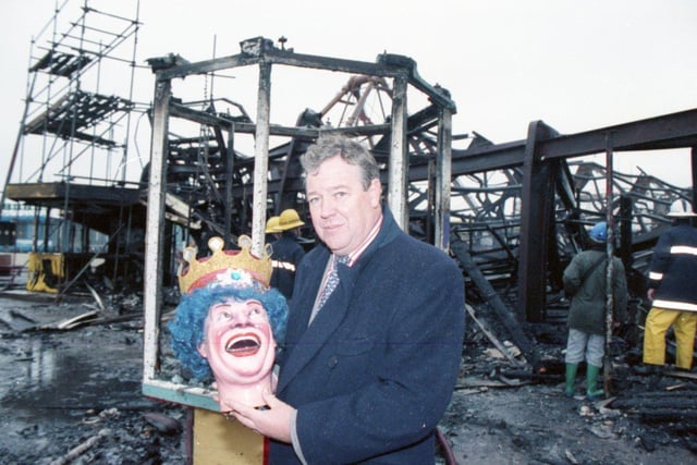 Geoffrey Thompson clutching the head of the famous Fun House clown plucked from the ashes of a blaze in 1991