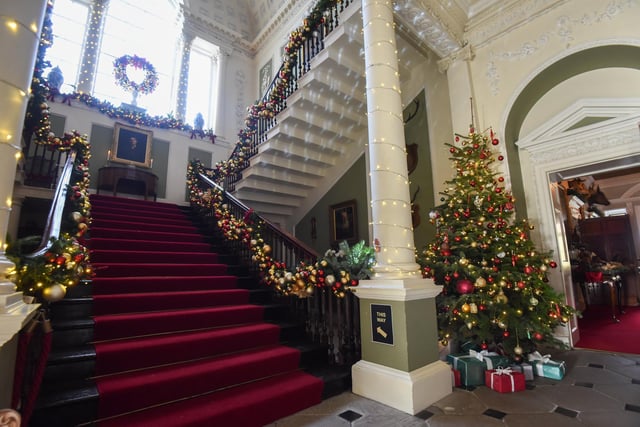 The main staircase is suitably adorned for Christmas at Lytham Hall.