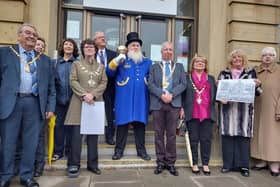 Town crier John Spencer Barnes at the ceremony with the civic party including Fylde mayor Elaine Silverwood, St Annes Town Council chairman Gavin Harrison and guest County Coun Barrie Yates (far left), chairman of Lancashire County Council. Coun Cheryl Little (second right) is holding an image of the 1922 ceremony.