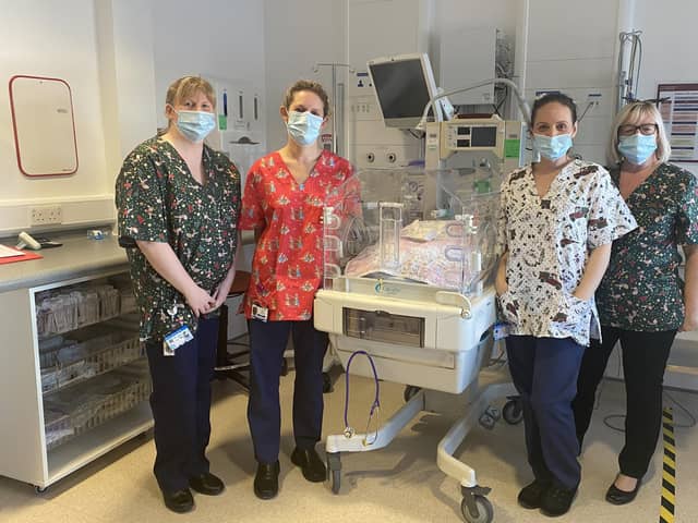 Sarah Heydon (neonatal sister), Gillian Jackson (nursery nurse), Sarah Steward (practice development sister), and Julie Kearney (matron) wearing the festive scrubs at Blackpool Victoria Hospital's neonatal unit