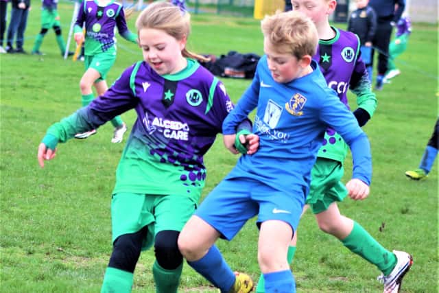 Under-9s action between St Annes Greens and Kirkham Junior Blues  Picture: B&DYFL