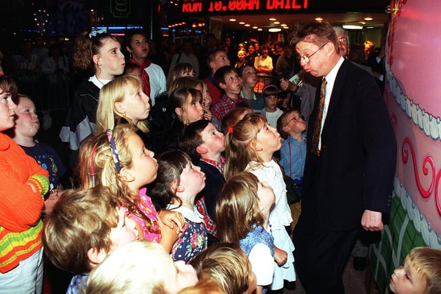 Actor Kevin Kennedy, alias Coronation Street's Curly Watts, does his best to blow out the lights with the help of some friends at the preview night of the Blackpool Illuminations in 1996