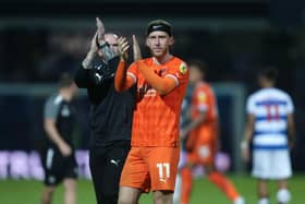 Josh Bowler applauds the Blackpool fans at the final whistle