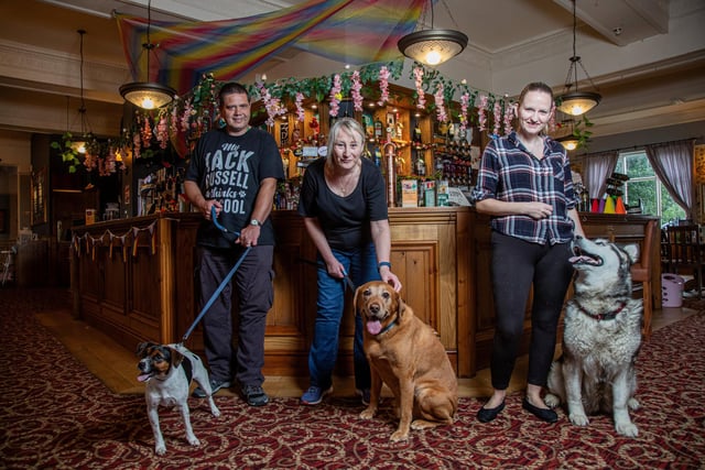 (L-R) Steven Truman, 49, with Buddy, 1, a Jack Russell Terrier, Sarah Porter, 59, with Charlie, 8 , a Fox Red Labrador, and Heather Porter-Brandwood, 35, with her dog Mya, 8, a Siberian Huskey.