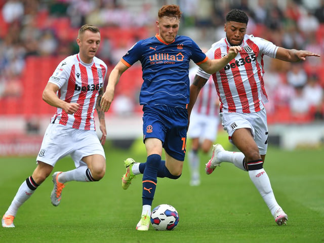 Blackpool's Sonny Carey battles with Stoke City's Ben Wilmot and Josh Laurent

The EFL Sky Bet Championship - Stoke City v Blackpool - Saturday 6th August 2022 - bet365 Stadium - Stoke-on-Trent