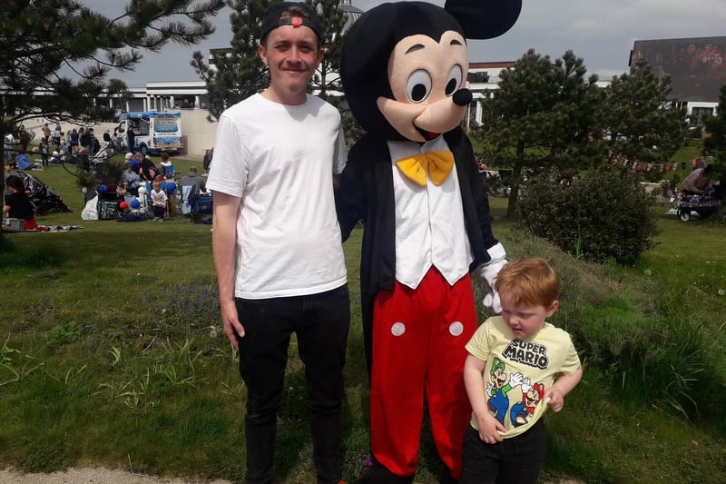 Jamie Porter and son Leo Porter, aged 3, with Mickey Mouse
