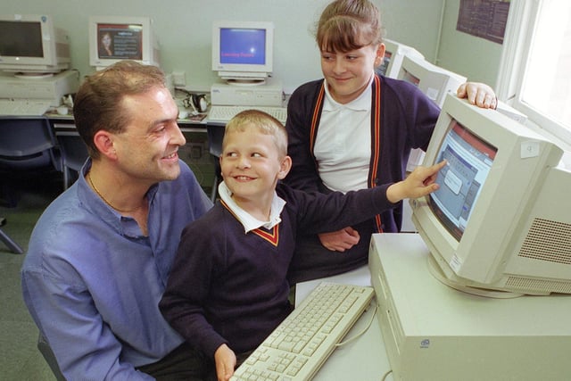 Internet training for adults at Waterloo Primary School. Craig (8) and Lorna Sharpe show Phil Jennings where he's going wrong
