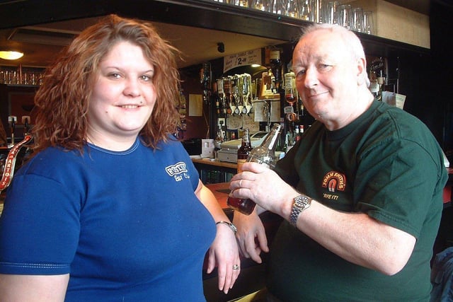 Barmaid Rachel Marchant and regular Frank Greenhalgh at the Victoria Pub in Dock Street
