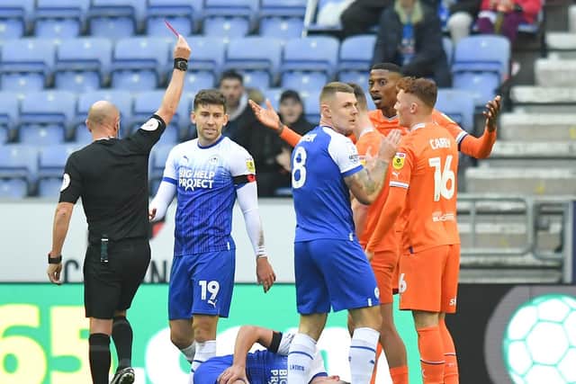 Marvin Ekpiteta was shown his second red card of the season during Blackpool's defeat against Wigan