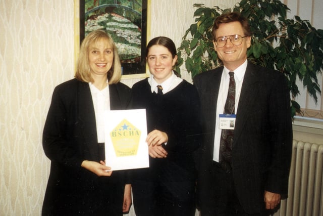 Winner of Logo 2000. From left: Kathy Ellis, executive committee member of Blackpool Self Catering Association; Natalie Bather and John McNaughton, head teacher of Palatine High School