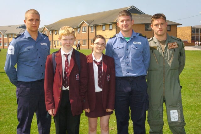 A Marlin Royal Navy helicopter landing at Montgomery High School playing fields. Former pupil CPO Ross Clegg, who was a member of the Royal Navy, revisited the school. L-R are crewmember Rob Blytham, pupil Chris Sheehan (15), Meg Gonzawa (14), Cpo Ross Clegg and LT Martyn Stackhouse