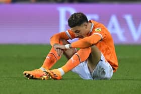 A dejected Morgan Rogers reacts to Blackpool's relegation being confirmed on Friday night