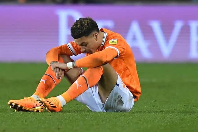 A dejected Morgan Rogers reacts to Blackpool's relegation being confirmed on Friday night