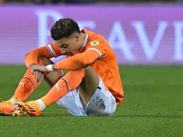 A dejected Morgan Rogers reacts to Blackpool's relegation being confirmed on Friday night