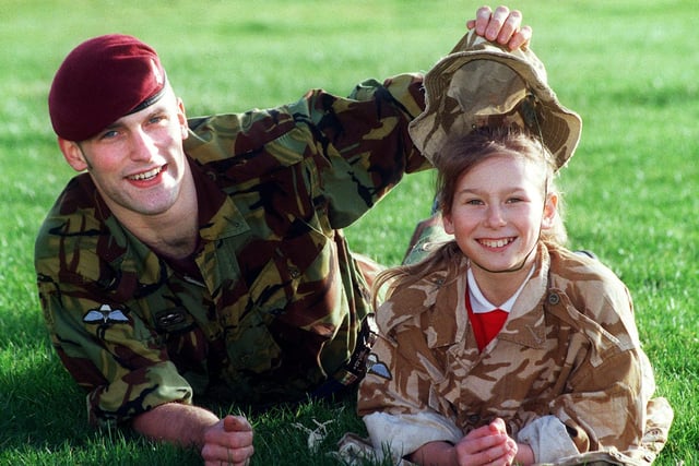 Pupils at St. Edmund's RC Primary School in Fleetwood have been learning about life in the army, and had the chance to meet a real-life soldier when Bombardier Mike Webb from the 7th Parachute Royal Horse Artillery visited the school. Who's under the camouflage? Mike reveals 10-year-old Emma Goddard