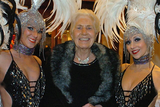The original Ma Kelly with showgirls