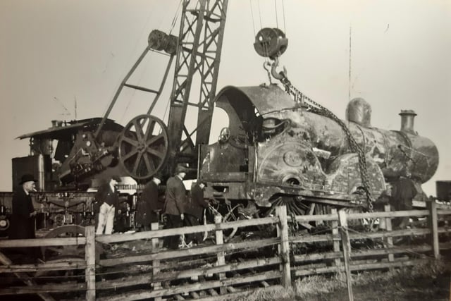 The caption on the back of this photo says the image was the day after the disaster - but which one? Judging by the steam engine and the clothing worn by the people in the photograph, this could be the Lytham rail disaster of 1924. A train travelling from Liverpool to Blackpool careered out of control and came off the tracks, leaving a trail of destruction in its wake
