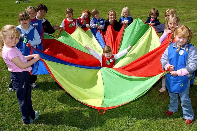 Girl Guiding Lancashire West Rainbow Romp at Fylde Scout Headquarters in St Annes. Five-year-old Hannah Lees (17th Blackpool Rainbows) is ready for a spin in the parachute