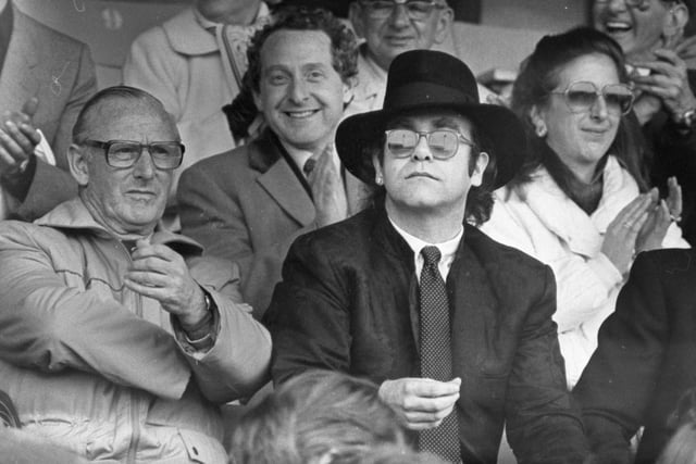 Looks like it could have been a tense moment at Sir Elton focuses on the game