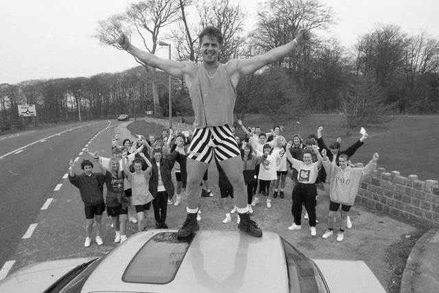 Passing motorists watched as an impromptu aerobics class was held by the side of a busy main road. As cars rushed past, aerobics teacher Kevin Meek put 40 women through their paces in protest at losing his regular venue - Ribby Hall Leisure Village, at Wrea Green. He led the ladies through their routine from the top of his car in a lay-by close to Ribby Hall