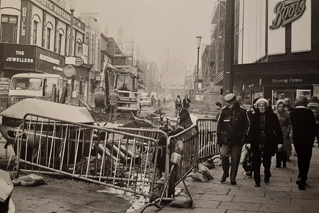 Boots and Beavebrooks the Jewellers here as the road is ripped up in Victoria Street, 1979