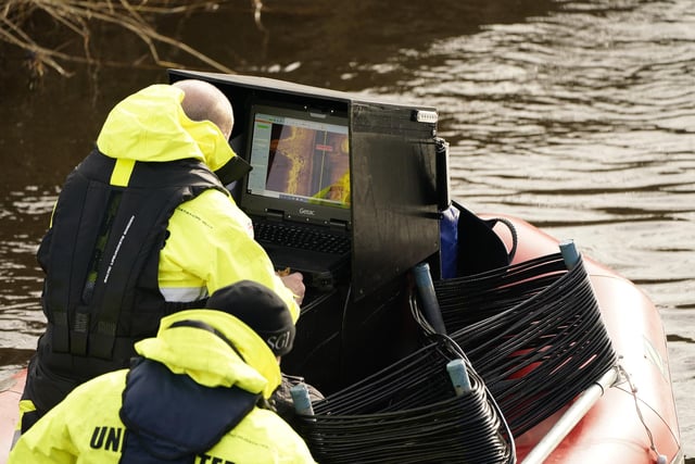 Workers from a private underwater search and recovery company, Specialist Group International, are using a 18kHz side-scan sonar on the River Wyre today. Picture by Danny Lawson/PA