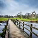 Bolton Abbey and the footbridge over the River Wharfe in the Yorkshire Dales National Park. PIC: Tony Johnson