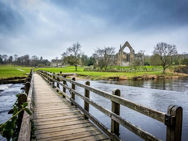 Bolton Abbey and the footbridge over the River Wharfe in the Yorkshire Dales National Park. PIC: Tony Johnson
