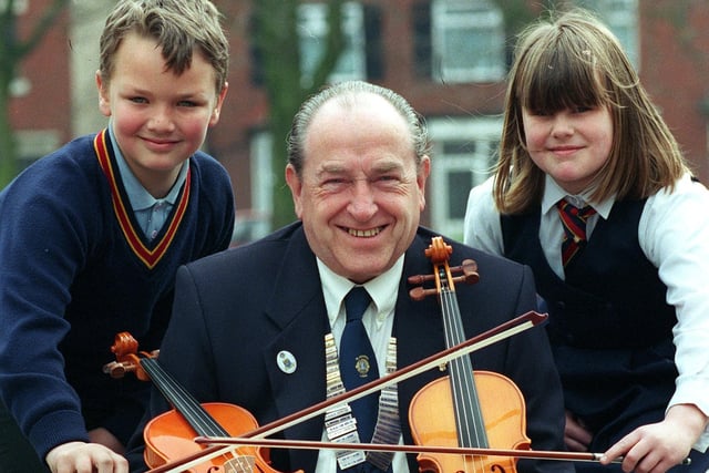 Blackpool Lions present musical instruments to Waterloo Primary School. Pictured L-R Alex Kay, President of Blackpool Lions Ken Ogden and Toni Thompson