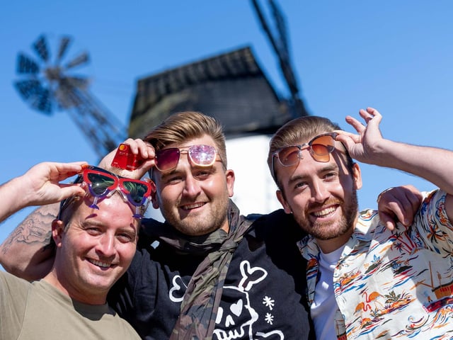More fans gather on Lytham Green, with the town's landmark windmill in the background