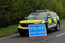 Motorists are advised of a road closure due to an overturned vehicle. Photo: Pacemaker