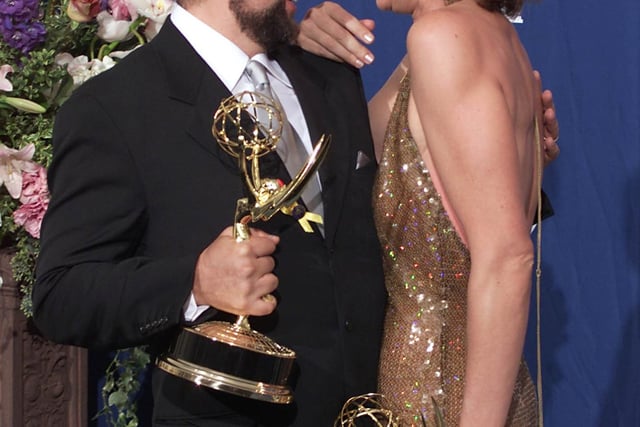 American serial political drama. Pictured: cast Richard Schiff and Allison Janney with their Emmy Awards in 2000.