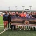 The fundraisers -  pictured at Blackpool FC's Bloomfield Road stadium - are all set for their three peaks challenge, beginning on Saturday June 4.