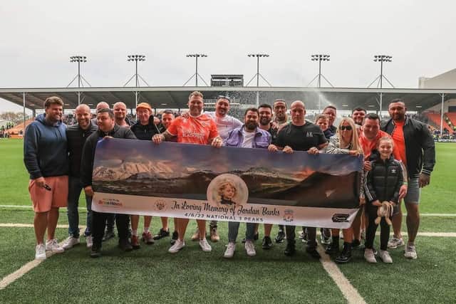 The fundraisers -  pictured at Blackpool FC's Bloomfield Road stadium - are all set for their three peaks challenge, beginning on Saturday June 4.