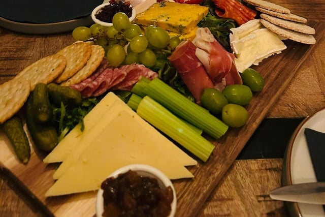 One of the charcuterie boards with a selection of some of the finest meats and cheeses