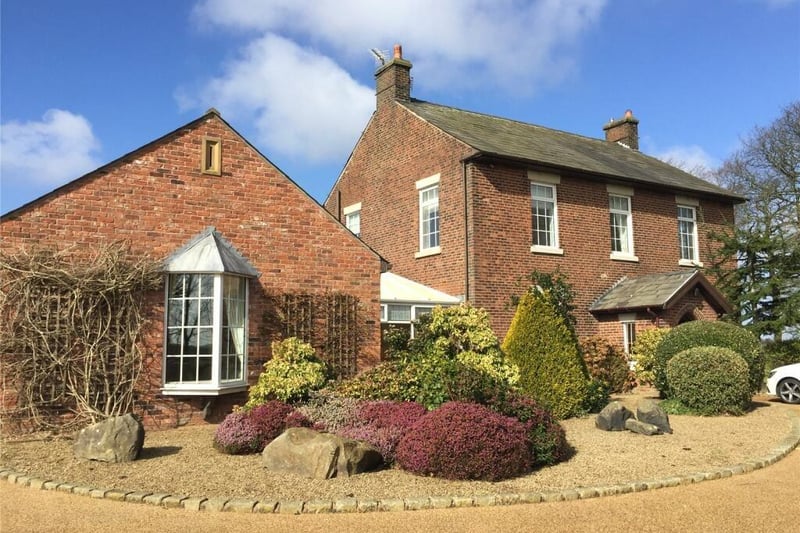 There are double steel gates which open to reveal the front of this strikingly beautiful house