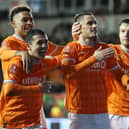 BLACKPOOL, ENGLAND - JANUARY 07: Jerry Yates of Blackpool celebrates with team mates after scoring their sides fourth goal during the Emirates FA Cup Third Round match between Blackpool FC and Nottingham Forest at Bloomfield Road on January 07, 2023 in Blackpool, England. (Photo by Alex Livesey/Getty Images)