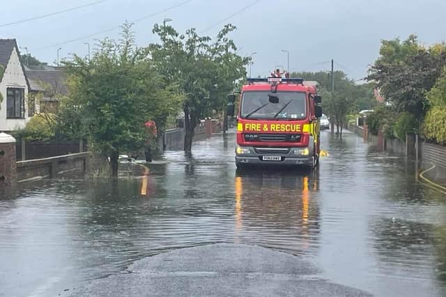 Fire engines attend flooding on Calder Avenue in Thornton