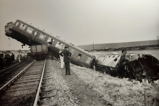 This was the aftermath of the Weeton Rail Disaster. Two front two coaches broke off from the rest of the train and tumbled down a 15ft embankment, landing in a field below