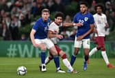 Nathan Collins of Republic of Ireland battles for possession with Ahmed Alaaeldin of Qatar during the International Friendly match between Republic of Ireland and Qatar. Typhoons built in Lancashire will provide air security during this winter's World Cup in Qatar