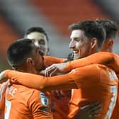 Blackpool claimed a 2-1 victory over Barnsley to progress in the EFL Trophy