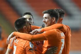 Blackpool claimed a 2-1 victory over Barnsley to progress in the EFL Trophy