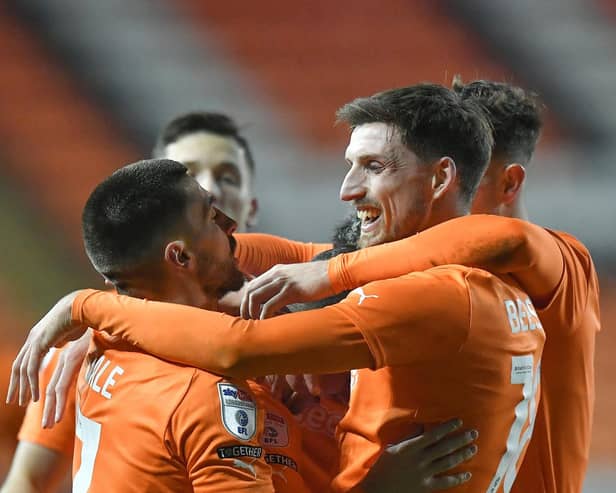 Blackpool claimed a 2-1 victory over Barnsley to progress in the EFL Trophy