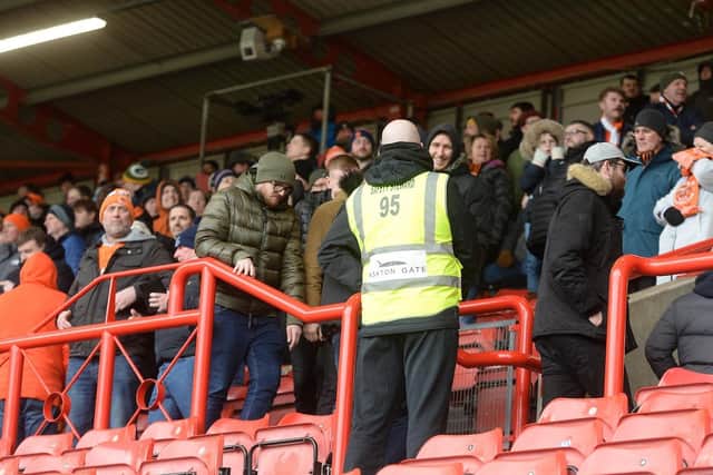 Blackpool's travelling fans, pictured here heading for the exits after the second goal, deserved better on Saturday