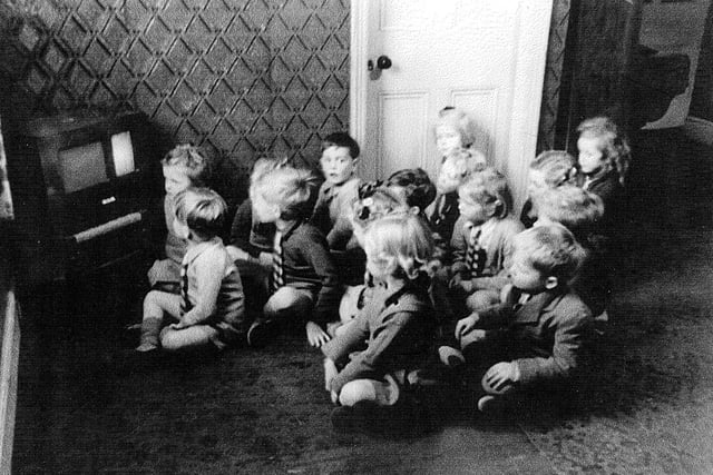 Children watch TV at Southdene School, South Shore